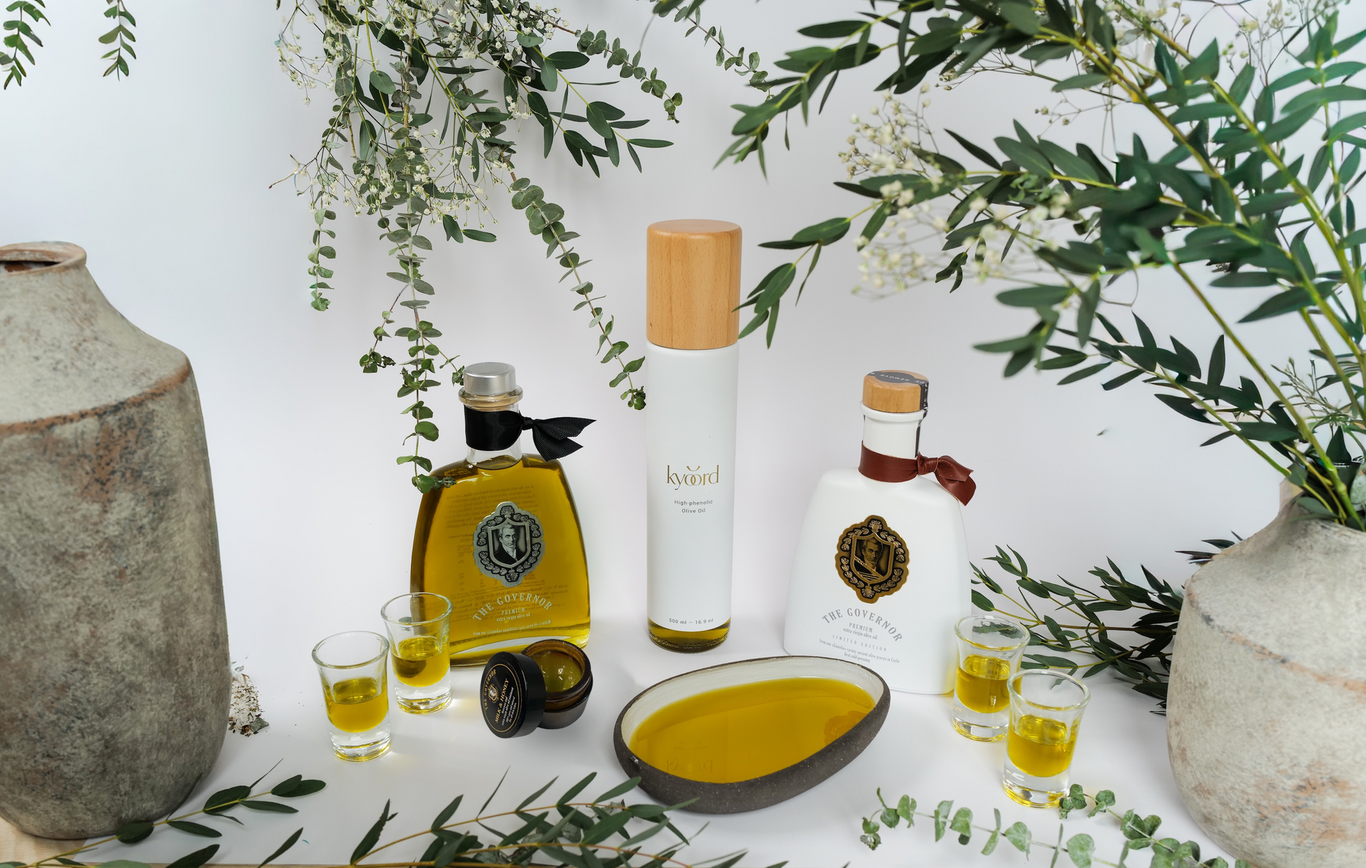kyoord olive oil gift set styled on a table with candles